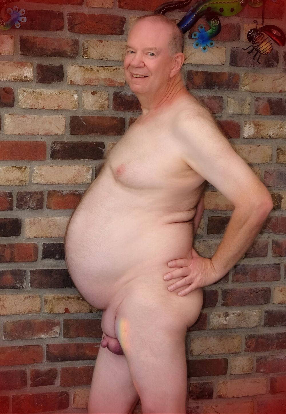 Fat Daddy Nick poses casually from a wall #5