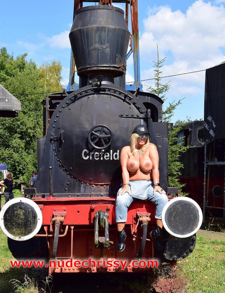 Naked between old locomotives #20