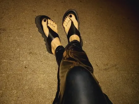 platform flip flops and latex pants         