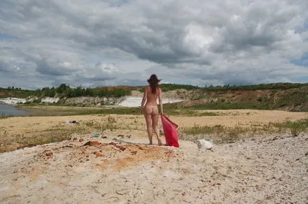 red shawl on white sand         