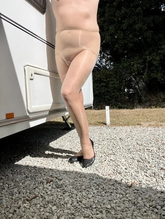 sissy in sheer pantyhose outside         