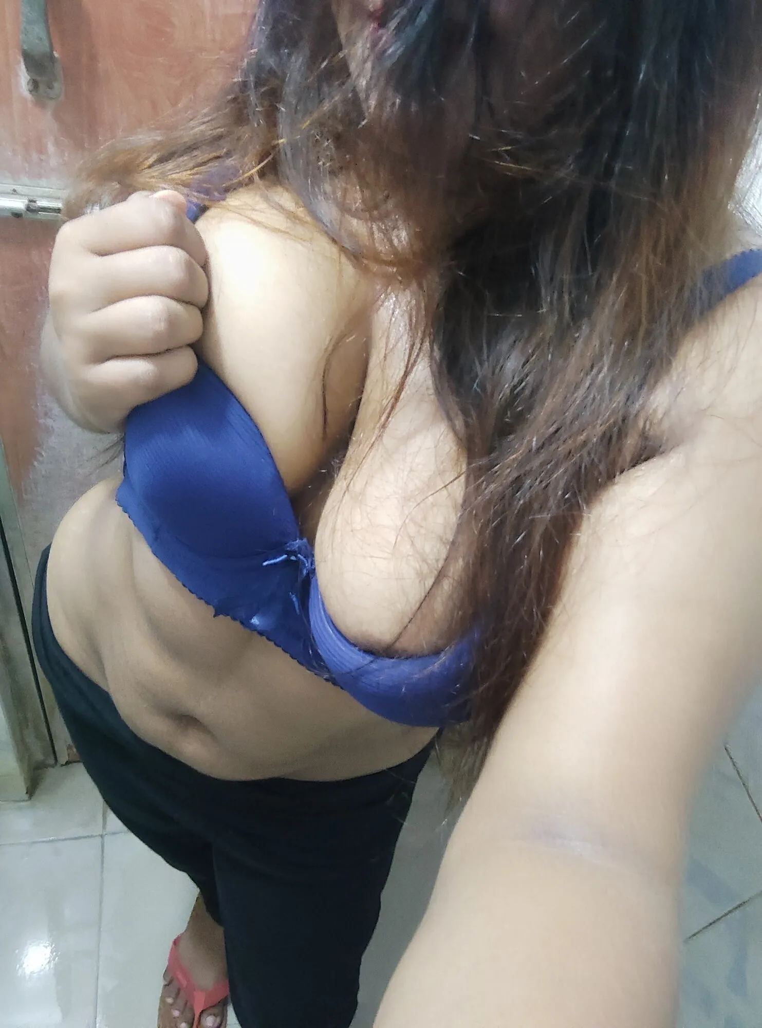 A picture of boobs wearing a blue bra.  #2