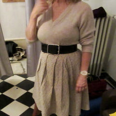 Her petticoat pressed her breasts forward