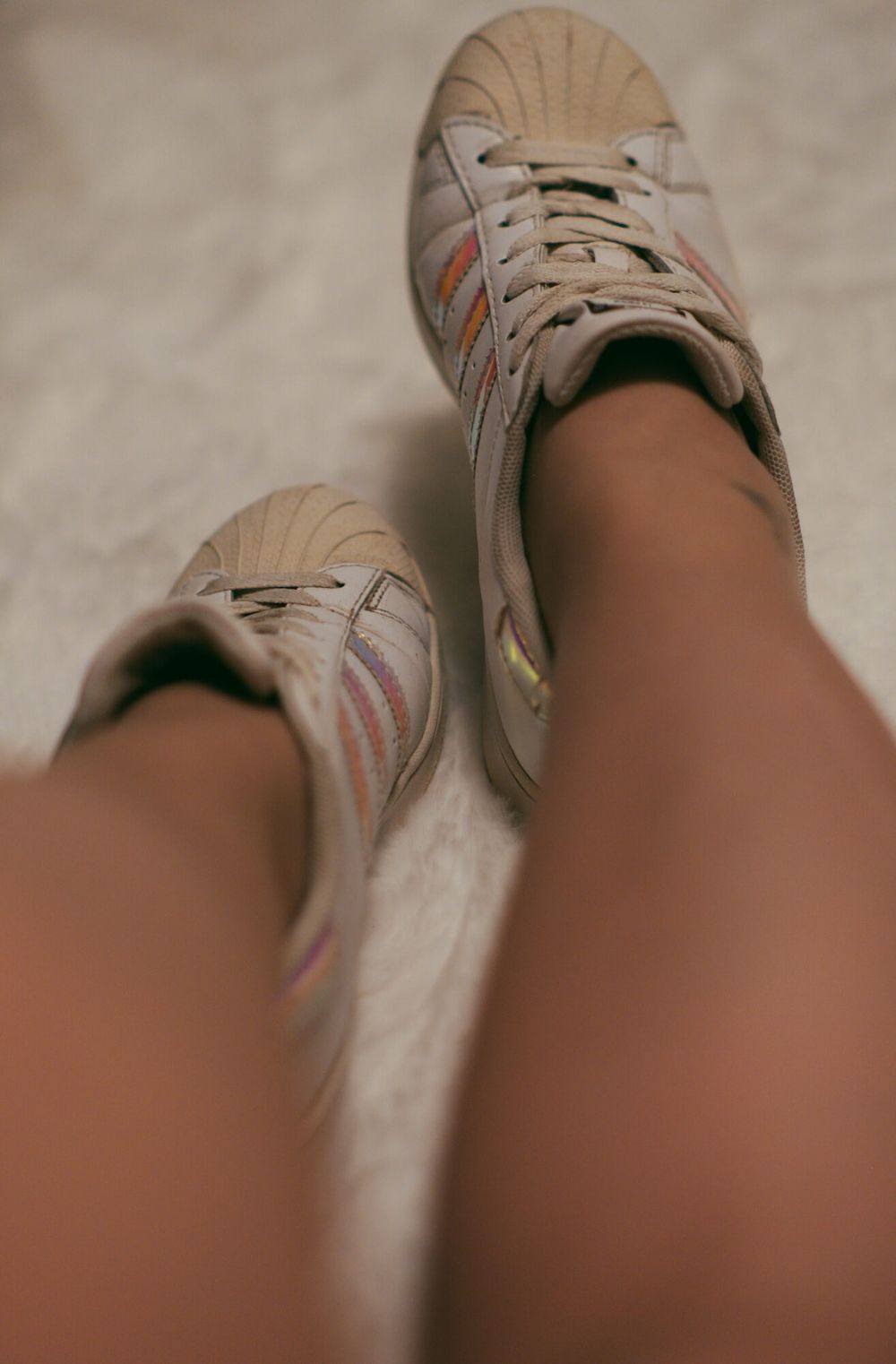 Feet in hot nylon and white Addidas sneakers #5