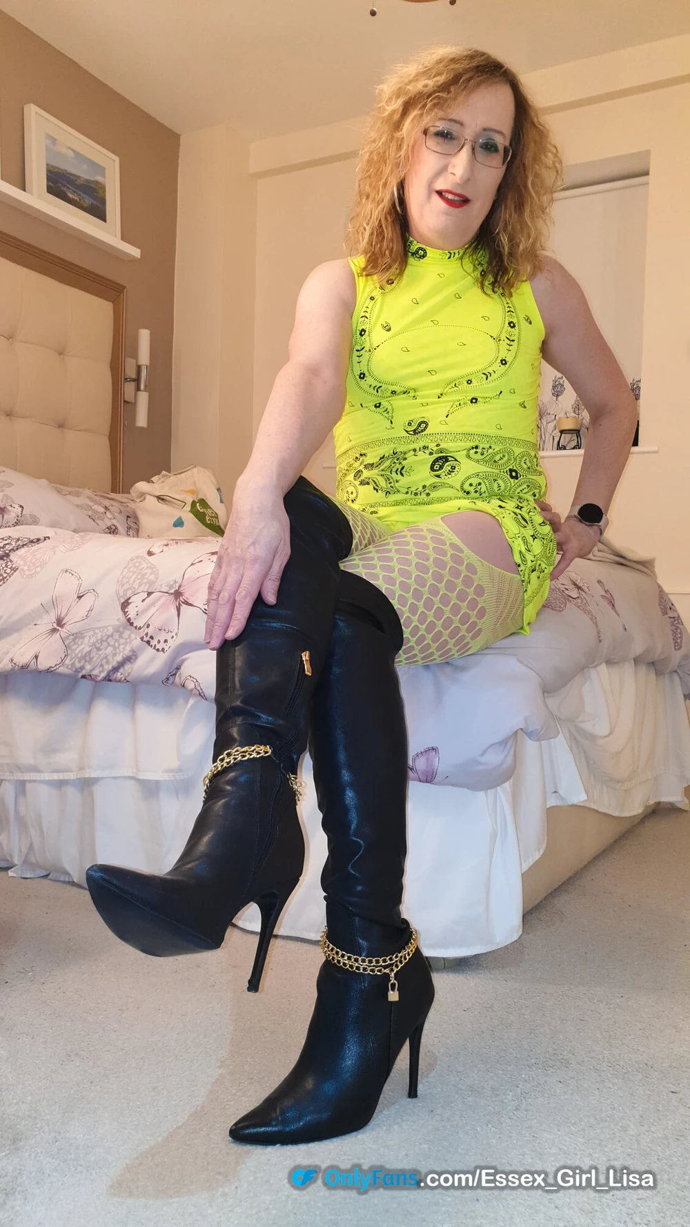 Essex Girl Lisa in neon yellow dress and black knee boots #11