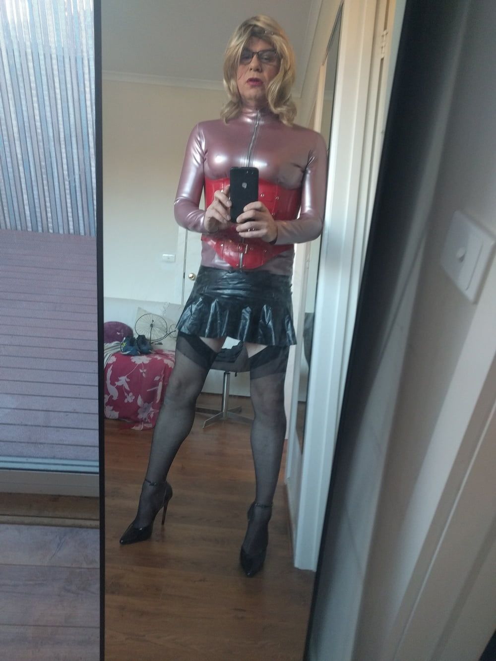Back as a short blonde latex girl #2