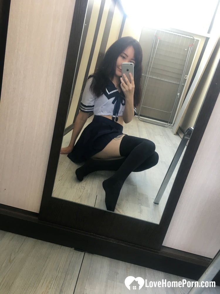 Asian schoolgirl flashing her pretty shaved pussy #7