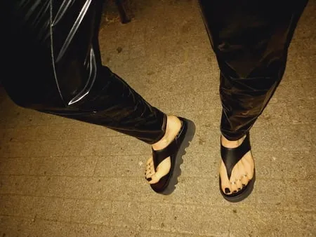 platform flip flops and latex pants         