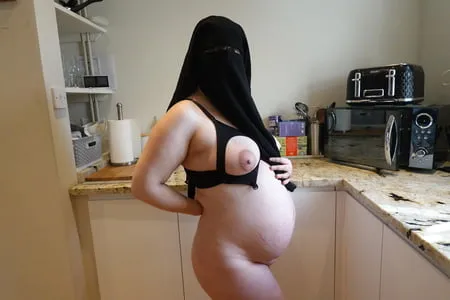 pregnant wife in muslim niqab and nursing bra         