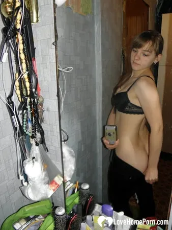 petite teen slowly strips off her clothes         