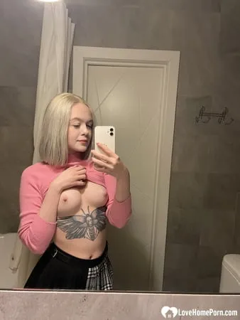 tattooed blonde showing off her sexy tattoos         