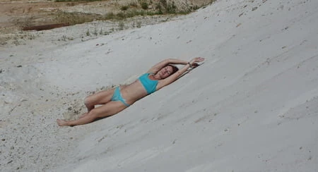 on white sand in turquos bikini         