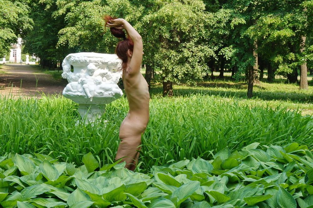 Naked in the grass by the vase #9