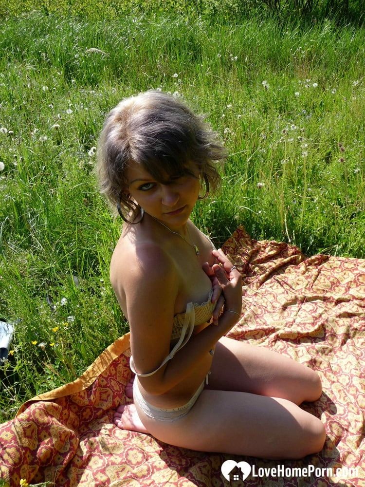 Gray-haired beauty posing naked outdoors on a blanket #37