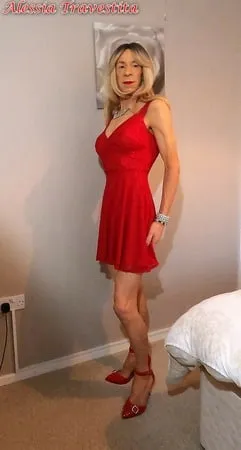    alessia travestita in flirty red dress         