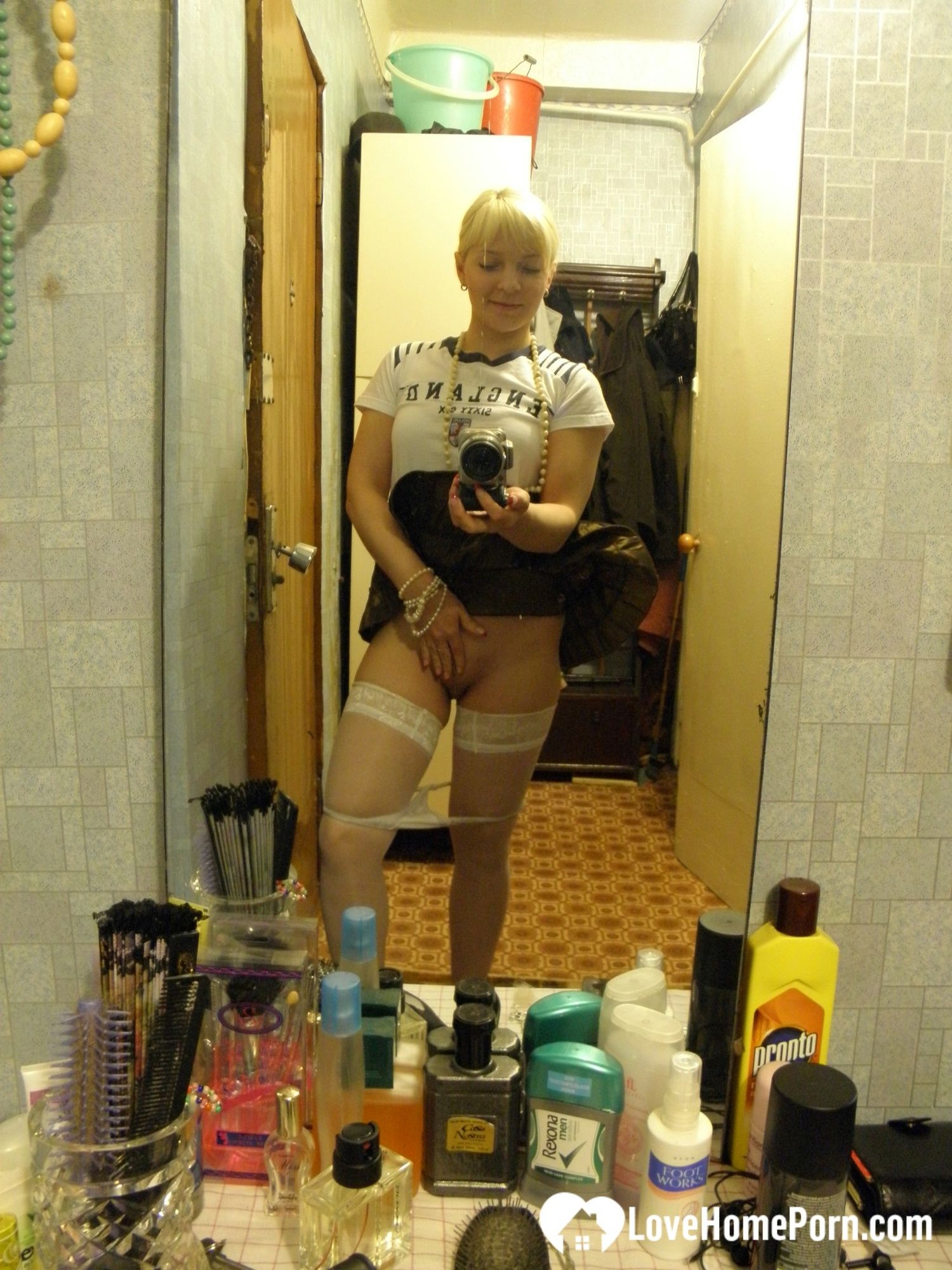 Aroused blonde in stockings taking naughty selfies #11