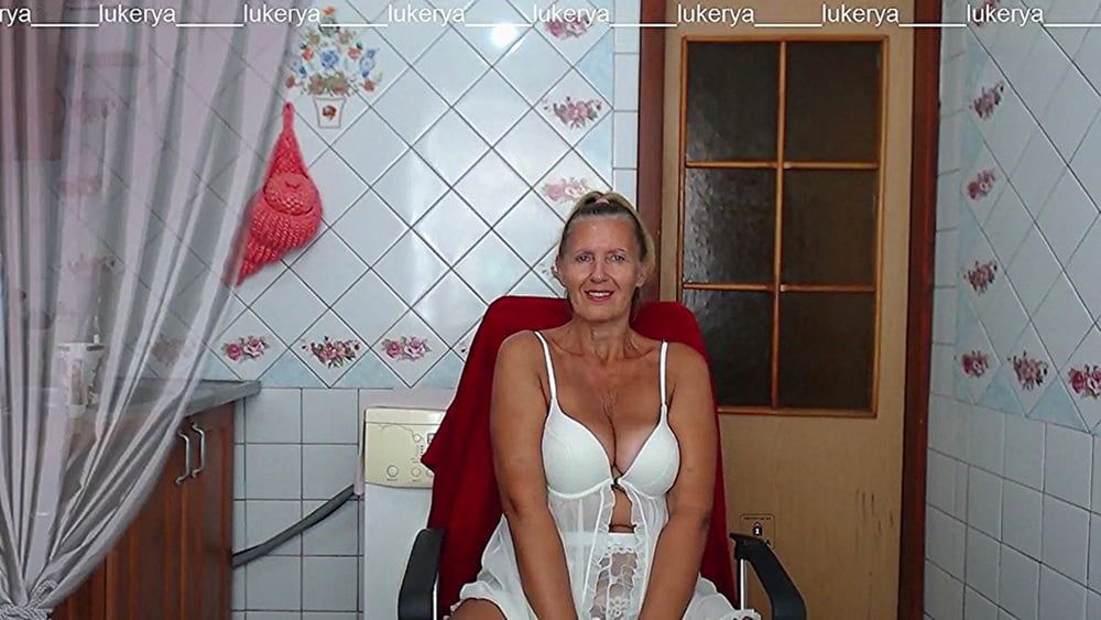 Lukerya in white transparent linen in the kitchen #34