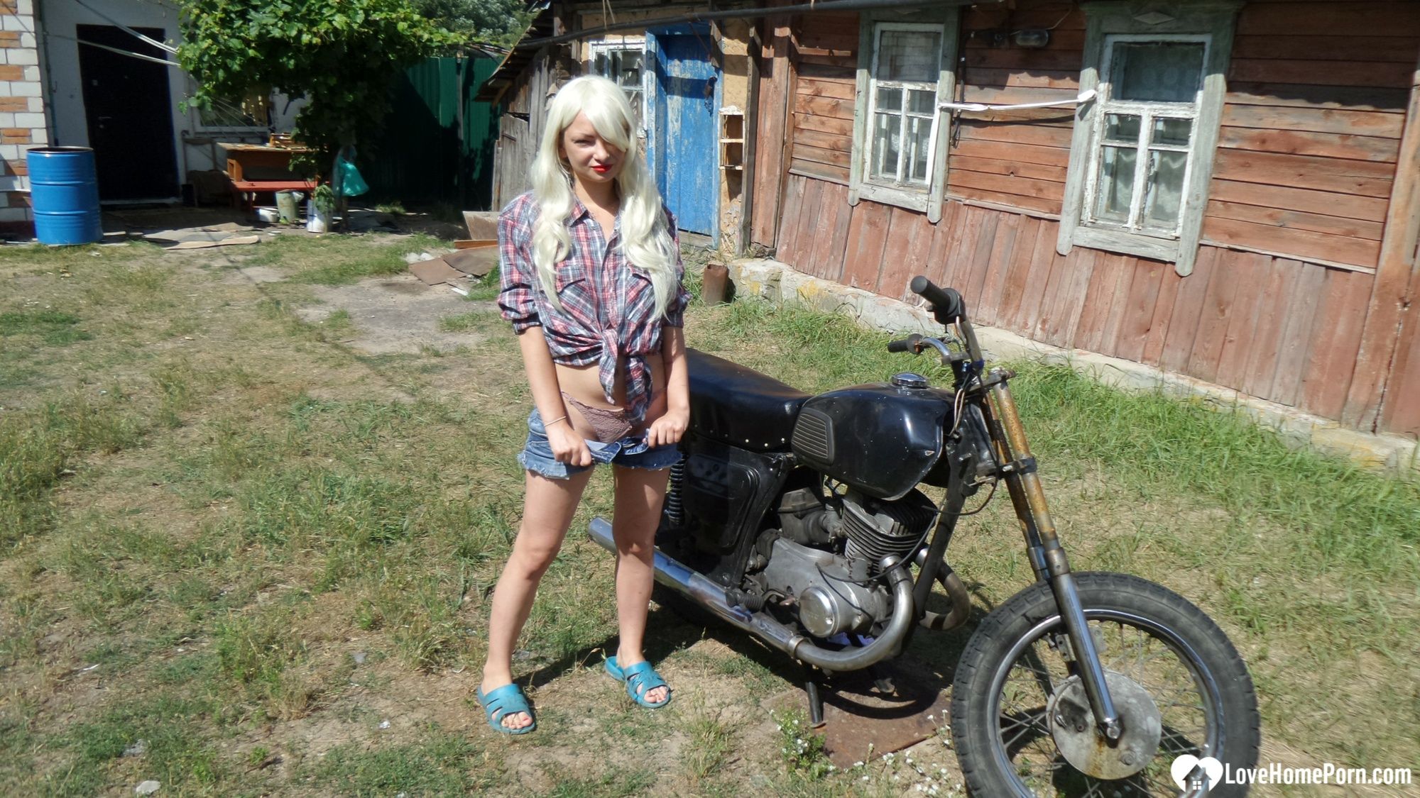 Blonde babe posing naked on a bike #8
