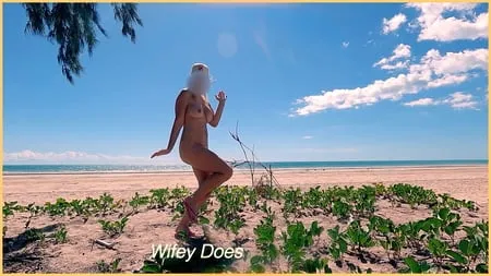 wifey goes dancing nude at a public beach         