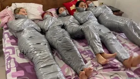   mummified girls barefoot in duct tape bondage         