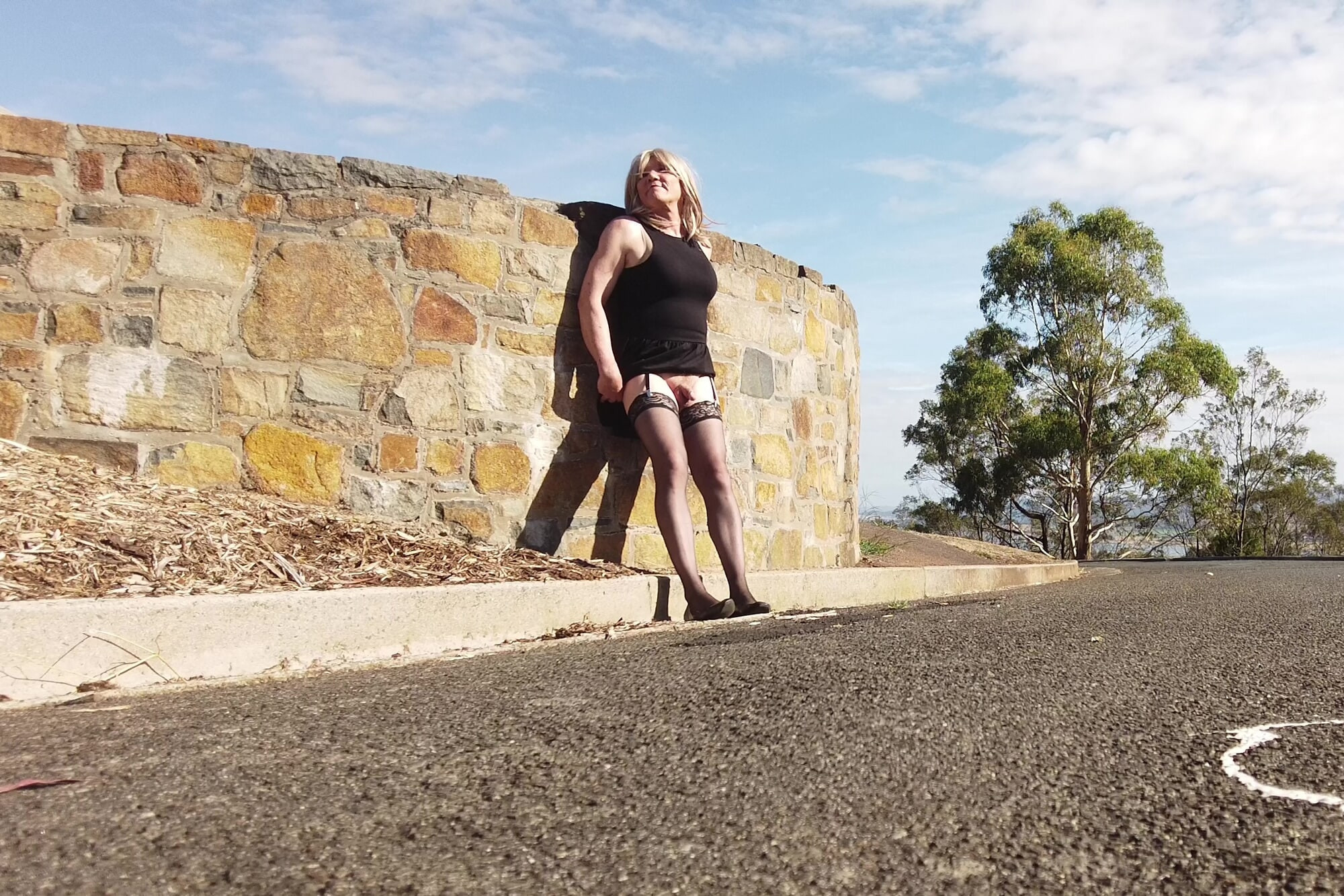 Crossdress Roadtrip - Sun baking against Stone Wall