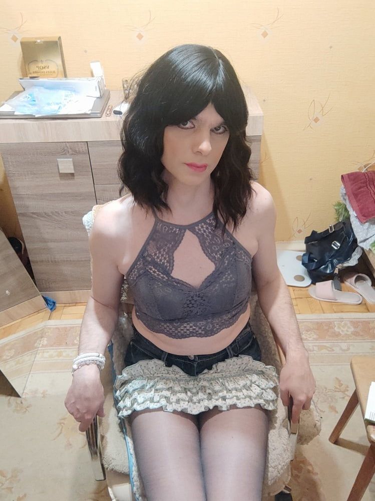 MaksiiCD posing in a sexy skirt