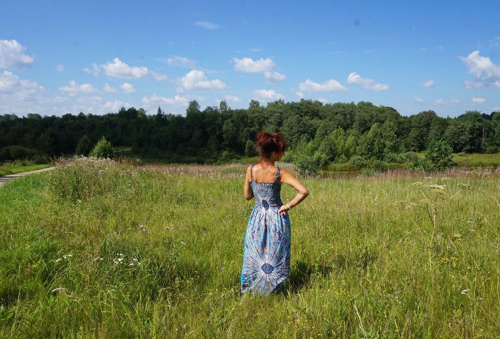 In blue dress in field #26