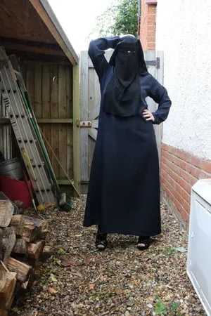 burqa outdoors flashing in the rain         