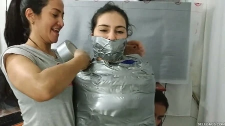 sexy girl trapped in ultra tight layered mummification         