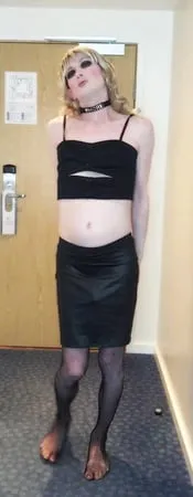 sissy crossdresser in black slut outfit posing         