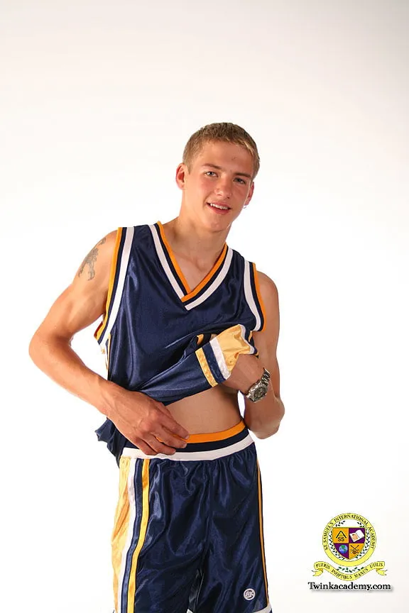 Blond teenage Latvian hunk poses in his basketball uniform