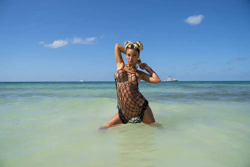 Hot Monika Fox In Black Mesh On Beach With Yachts In Backgro