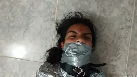 heavily duct tape mummified by crazy bondage women         