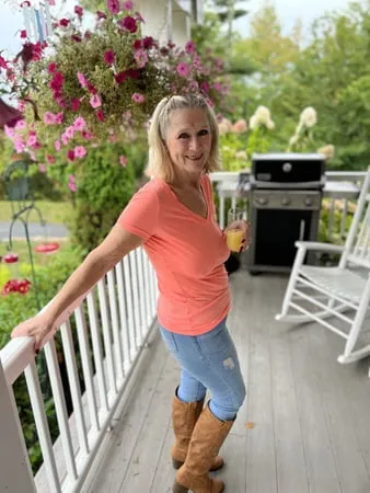 orange top and blue jeans         