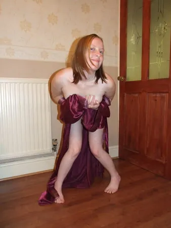 young wife posing in silk nighty         