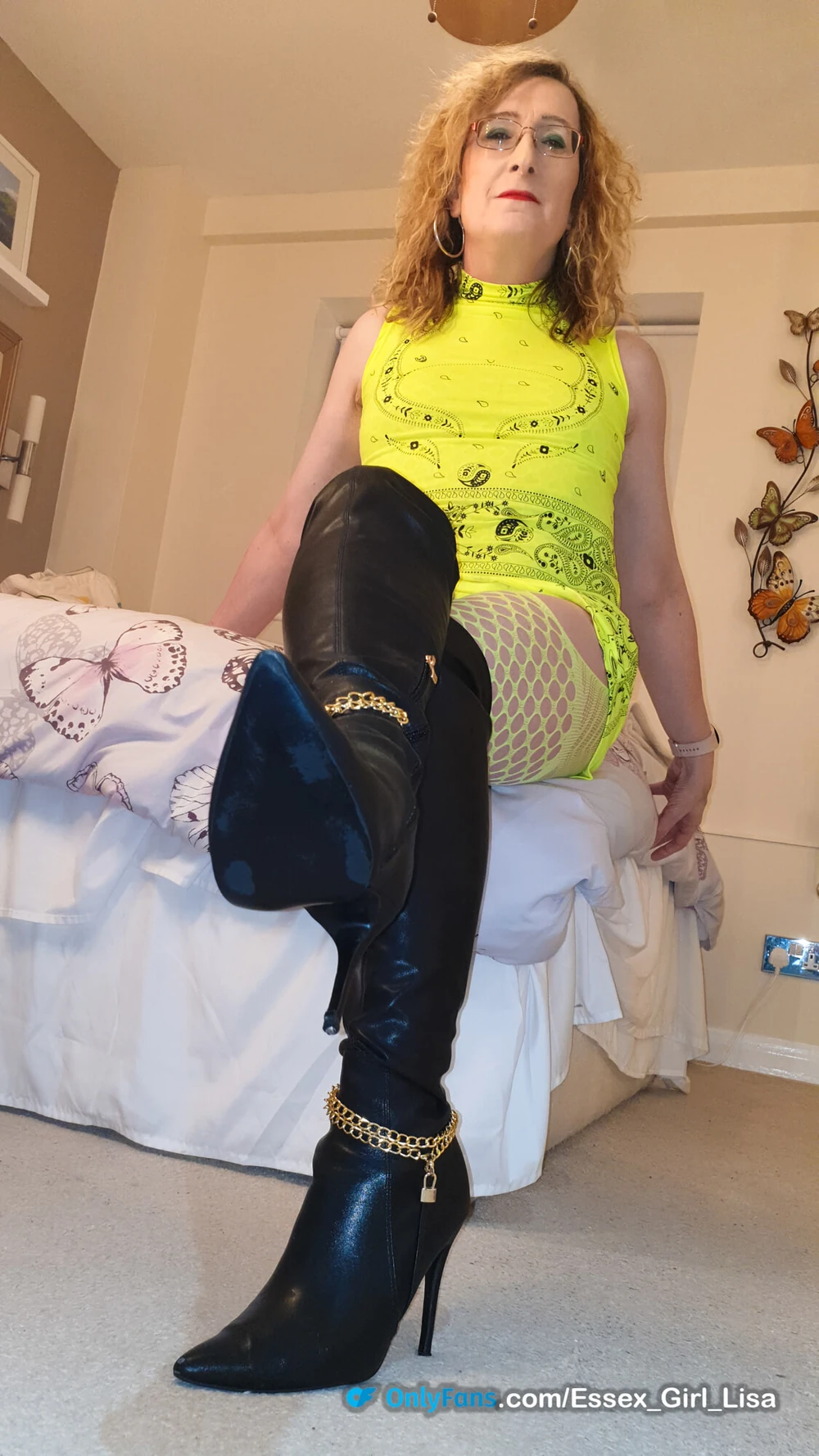 Essex Girl Lisa in neon yellow dress and black knee boots #12