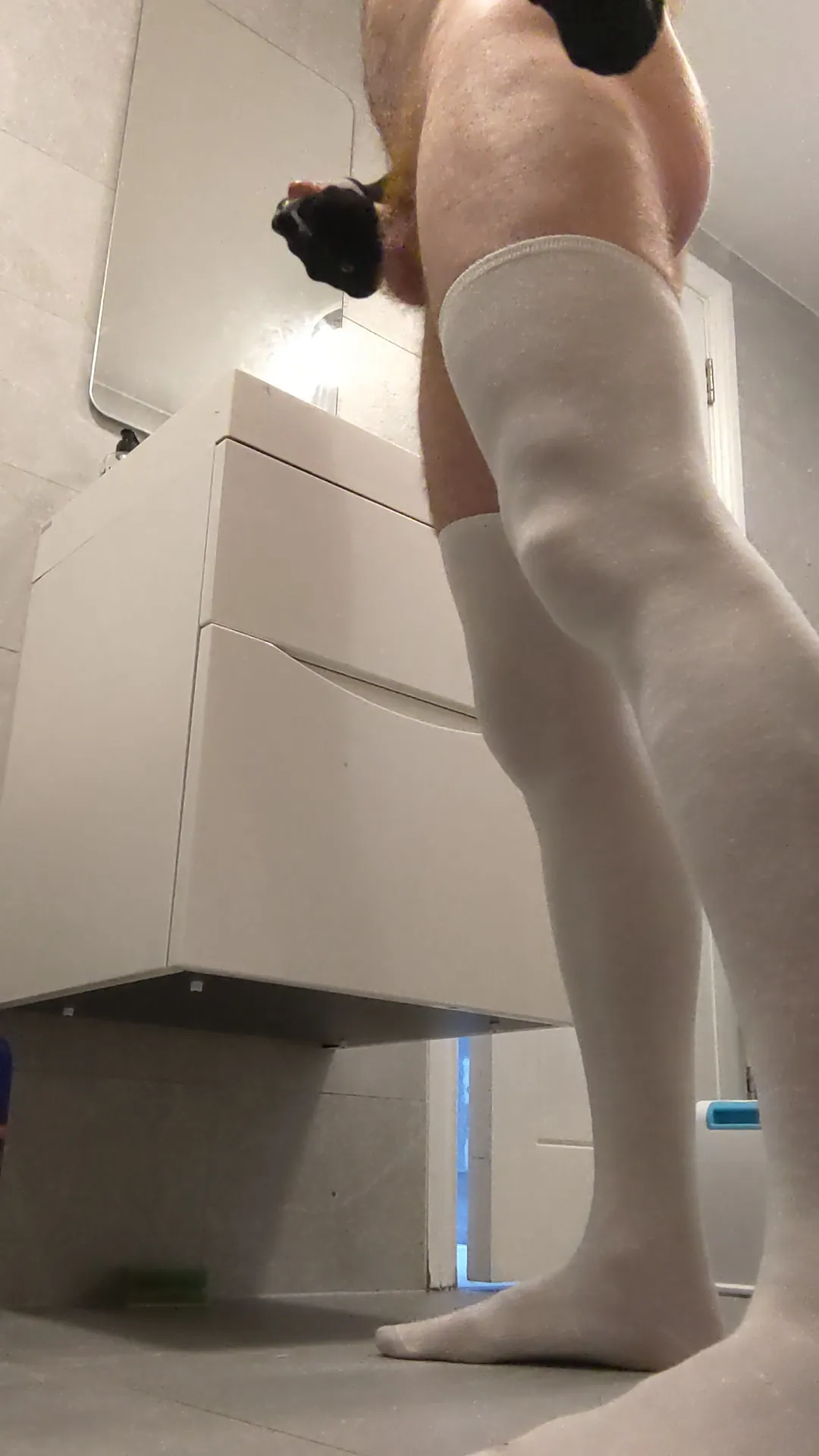 White cotton stockings gripping tightly to feet and legs