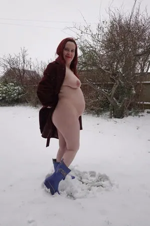 pregnant flashing naked in the cold snow         