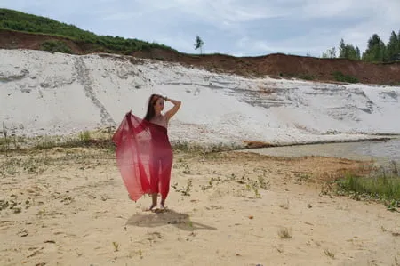 red shawl on white sand         