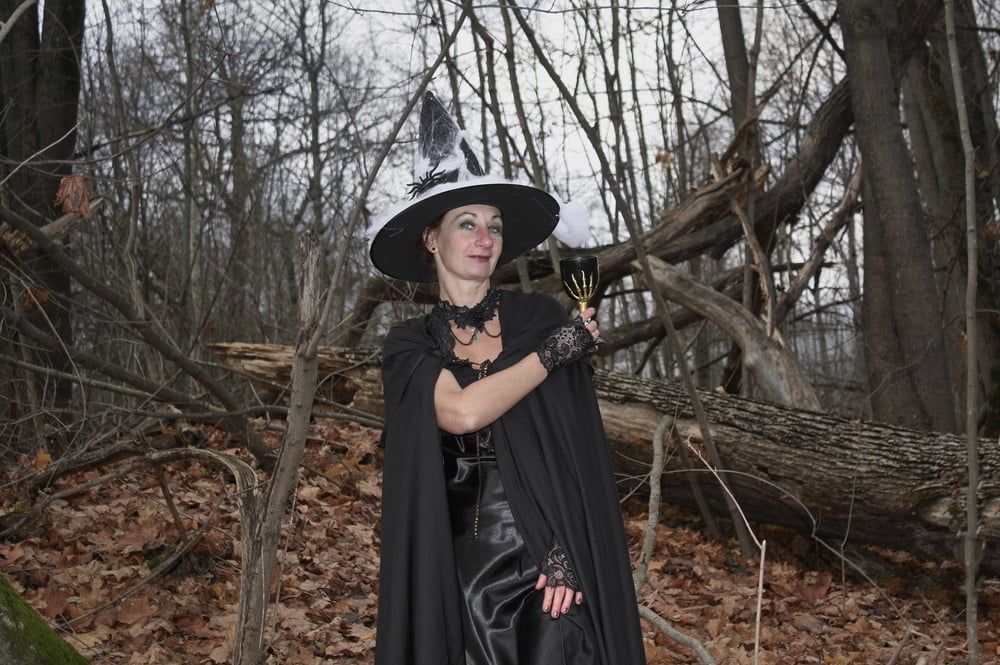 Witch with broom in forest #10