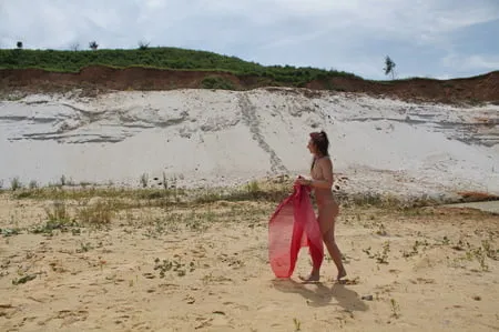 red shawl on white sand         