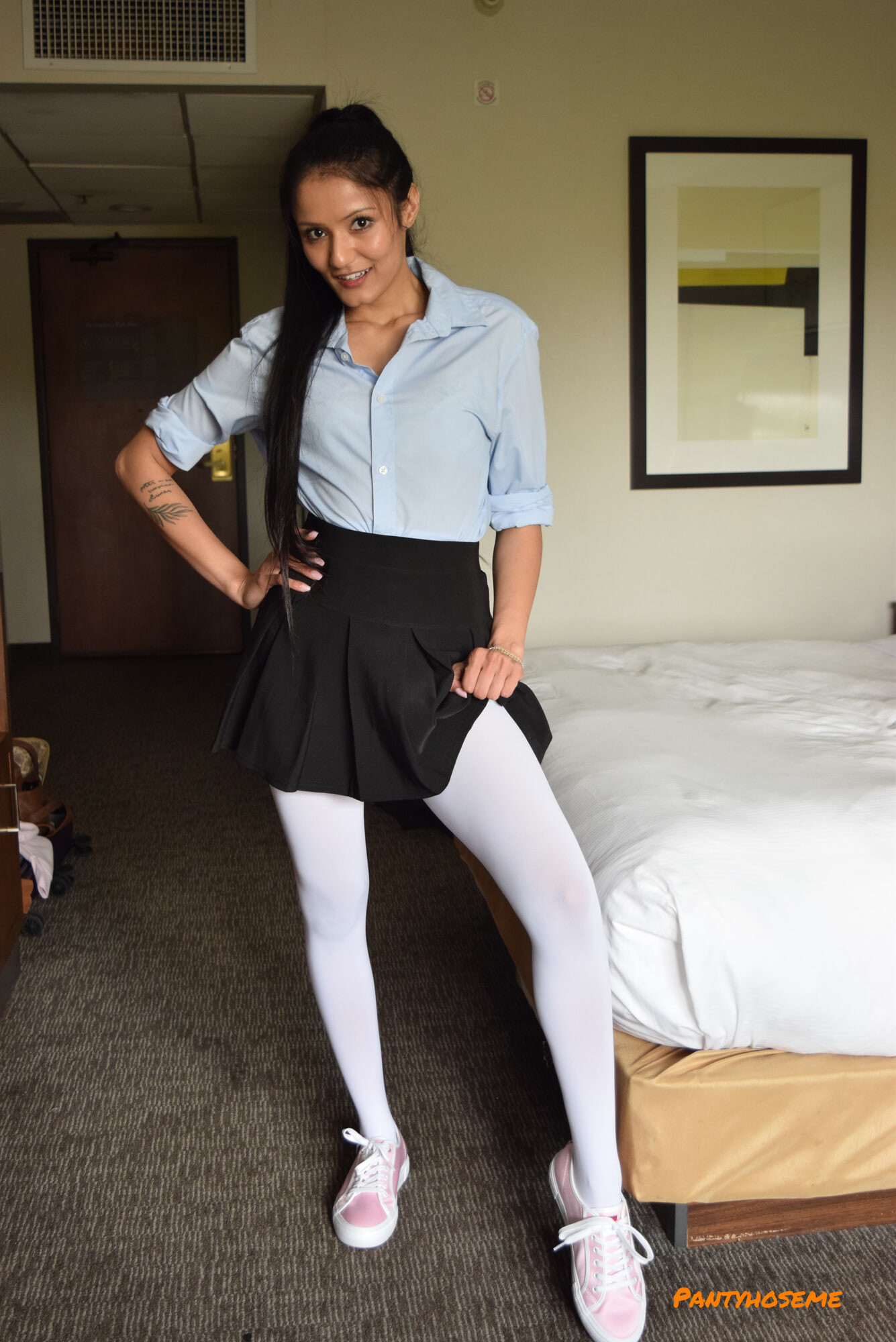 Brunette In Pleated Skirt and White Pantyhose Stripping