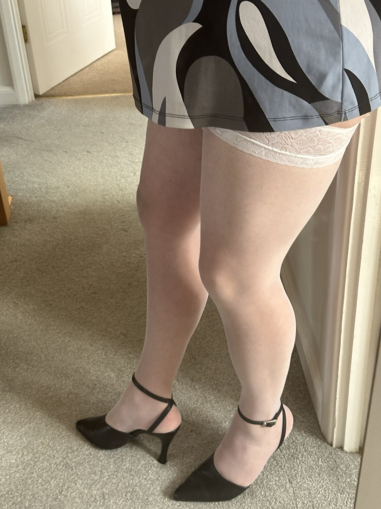 Crossdresser wearing White Stockings and sexy Heels