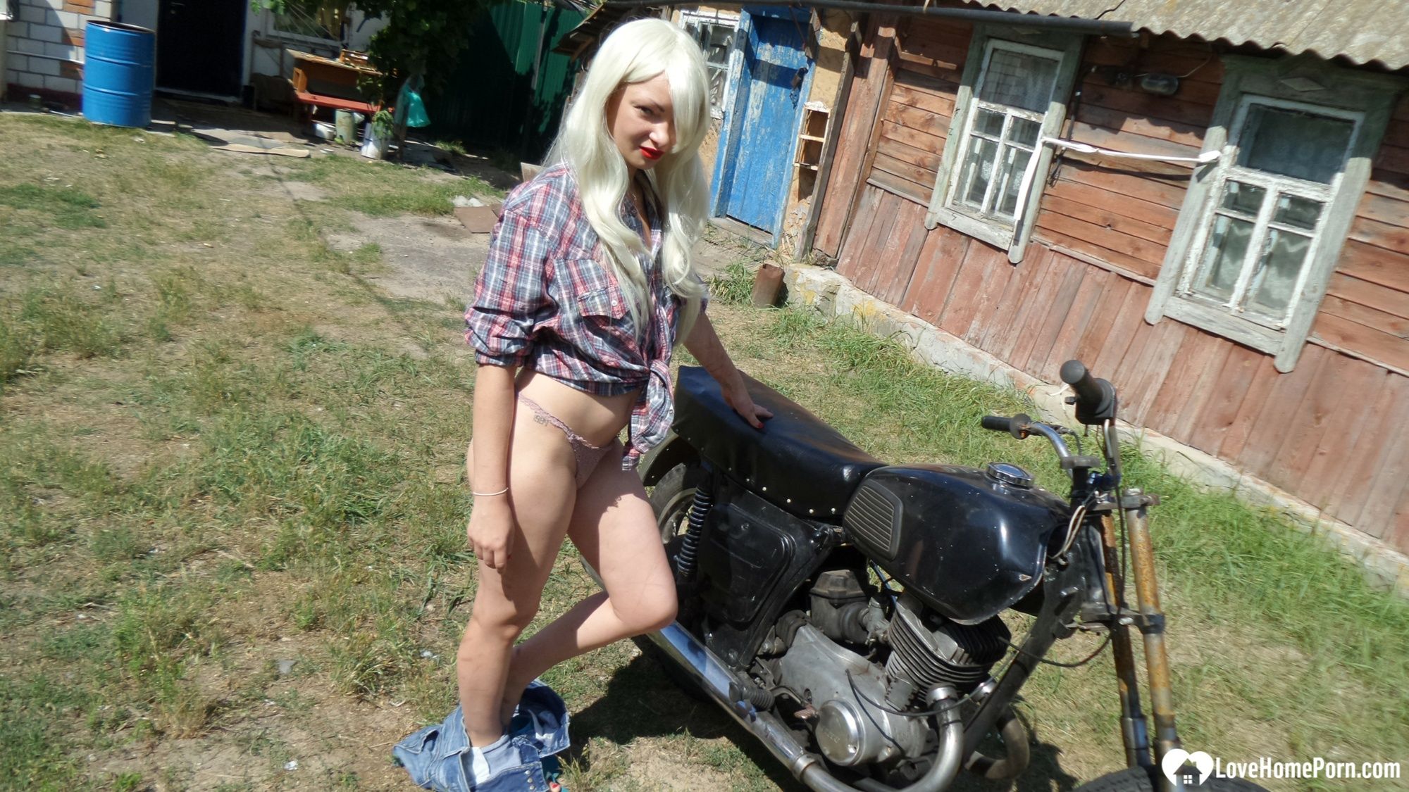 Blonde babe posing naked on a bike #13