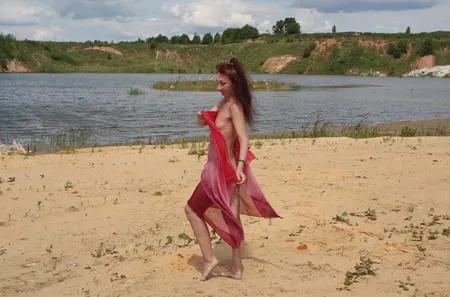 red shawl on white sand         