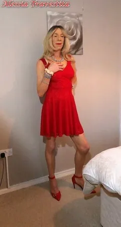    alessia travestita in flirty red dress         