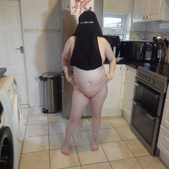 Naked in Niqab and white Knee Boots