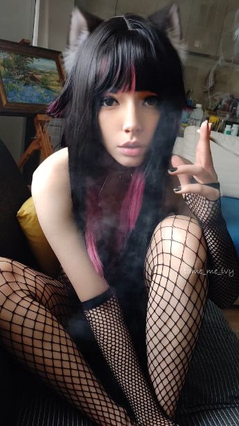 Succubus Babe smoking in fishnets