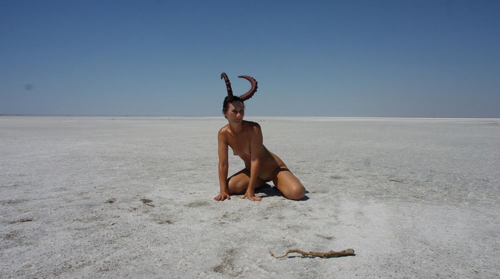 Standing naked on the salt of the salt lake Elton #9