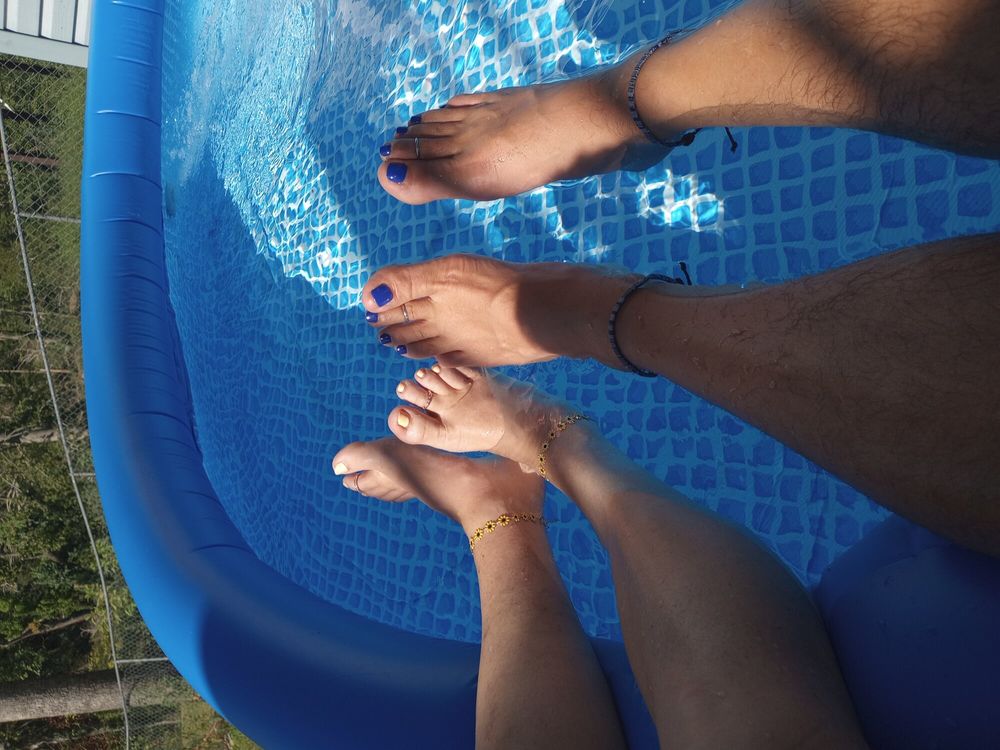 Showing off our pedicures in the pool #7